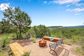 Fire pit and seating area with amazing hill country views.
