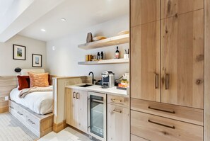 Suite Interior: King bed, day bed, 55” Smart TV, bluetooth speaker, humidifier,  seating areas