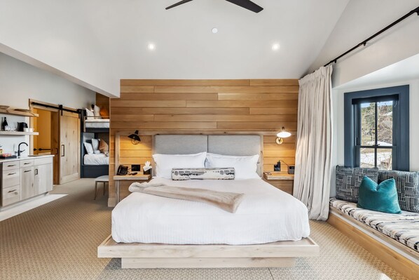 Suite Interior: King bed, twin bunk-beds, kitchenette, bay window, wardrobes