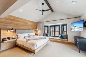 Suite Interior: King bed, twin bunk-beds, kitchenette, bay window, 55" smart TV, wardrobes