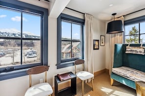 Suite Interior: King bed, 40" Smart TV, Bluetooth speaker, humidifier, Topo Designs backpack, yoga mat, reading chair