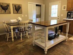 Kitchen island for additional work space. Washer/ dryer in closet.