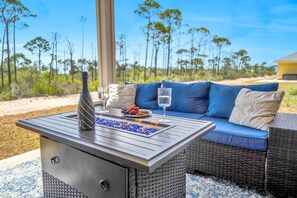 Fire pit table with a BBQ grill adjacent