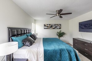 Masters bedroom with King size bed and smart tv.
