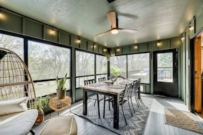 3 Season screened in porch complete w/ dining table for 6, cozy egg chair, ceiling fan and string lights to set the mood!