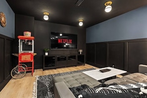 Movie room w/ a 75" HD TV, Popcorn Machine with Popcorn Kernels Provided, Dimmable Lights, and 2 L-Shaped Comfortable Couches;

Login to your apps on this smart tv!