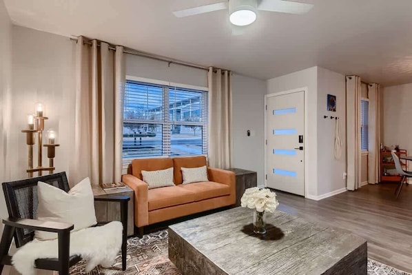 Welcoming entry leads to a spacious living room perfect for relaxation and gatherings. Enjoy the warm ambiance, natural light, and stylish design that create a cozy yet elegant space. Whether hosting guests or unwinding after a long day, this invitin
