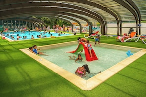 Indoor splash zone with warm water and fun for all ages, perfect for any weather.