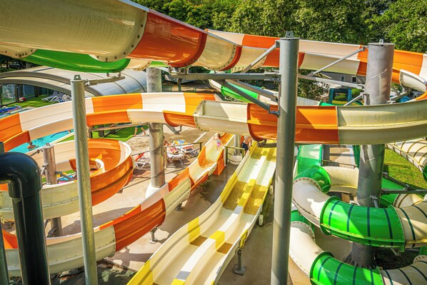 Exciting water slides winding through the park, ready for thrilling rides and endless fun.