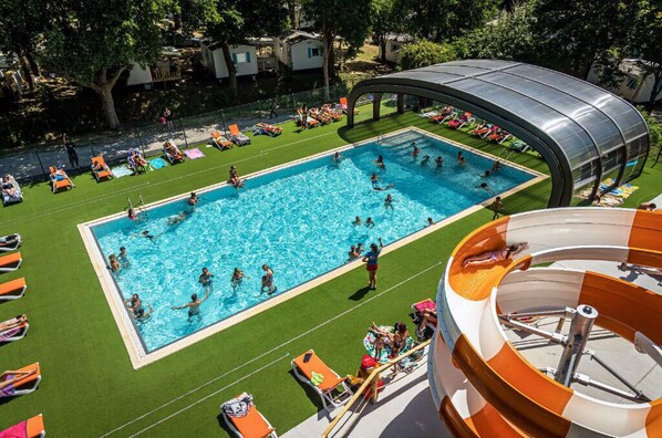 Large outdoor pool area, where guests can swim, relax, and soak up the sun.