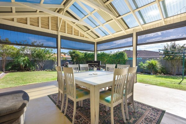 Outdoor living - wind and weatherproof blinds, BBQ, wall heater, fan and comfy couch :)