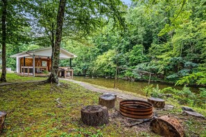 Firepit area is located just steps from the pavilion and the river.