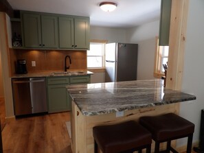 Open kitchen to living and dining area. 