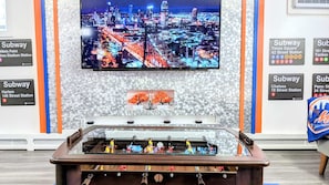 65 inch TV with Foosball coffee table