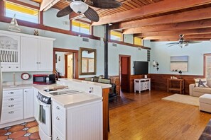 Large light filled living room with exposed beams