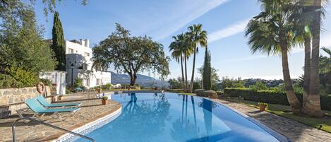 This apartment includes a lovely pool with a great view