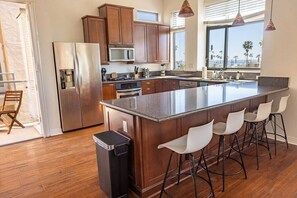 Kitchen with open layout to dining and living room