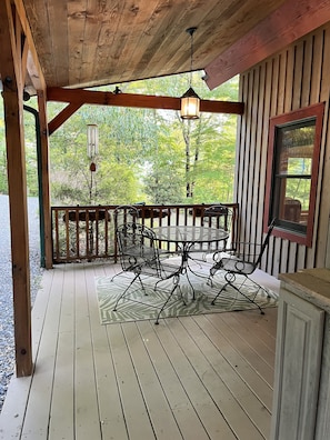 Eating area on Front Porch. Enter cabin into kitchen with no steps to climb.