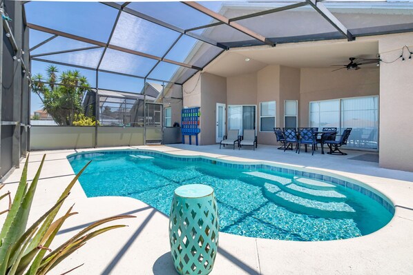 West facing fully screened in pool with lower privacy panels. 