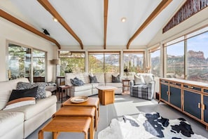 The spacious living room with copious amounts of natural light