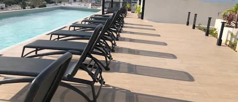 Rooftop Adults Only Pool. Shaded area and lots of lounge chairs 