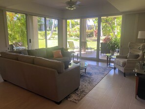 View of lanai from the living room. Plantation panels slide closed for privacy. 