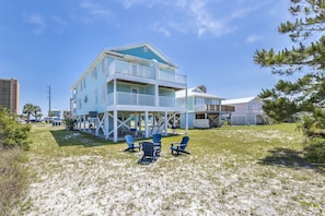 Ample yard space with fire pit and 4 Adirondack Chairs