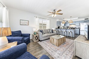 Unit A - open living room that flows into the fully stocked kitchen