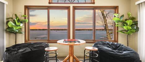 Upstairs game room with plenty of room to relax with family and friends and a lakefront view!