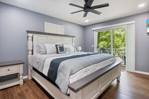 A true oasis of comfort in the master bedroom with its breathtaking lake view and balcony access.