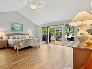 The master bedroom offers lake views and deck access