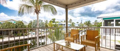 Relax and watch the boats go by from the comfort of your screened porch at "Way To The Ocean."