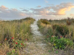 Enjoy sunrises and constant trips to the beach through your private beach access