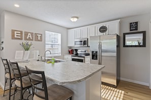 Share good food in this welcoming dining and kitchen space