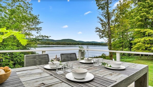 Enjoy lake views while dining outside, whether you order in or prepare a meal in the gourmet kitchen. 