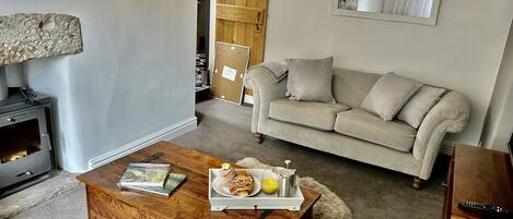 Living room with beautiful log burner. 
