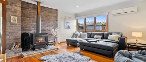 Fire place or heat pump you choose. Family  room comfily and warm with large smart TV.