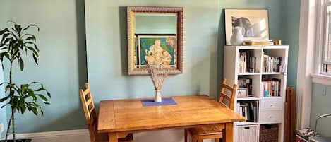 Sunny living room with large oak dining table. I often work there also.

