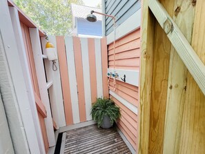 Private outdoor shower on the back side of the home