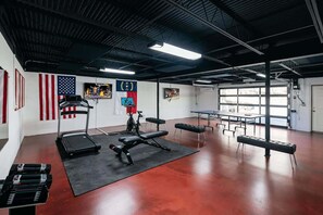 Gym with Peloton, treadmill, and ping pong