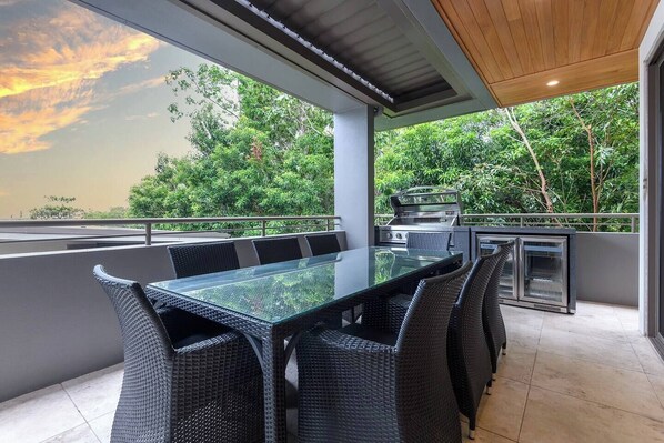 Witness captivating sunsets from the private balcony off the main living area.