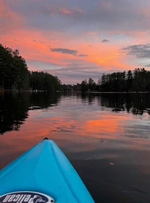 Loon Lake at sunset. Kayaks and a canoe for rent.