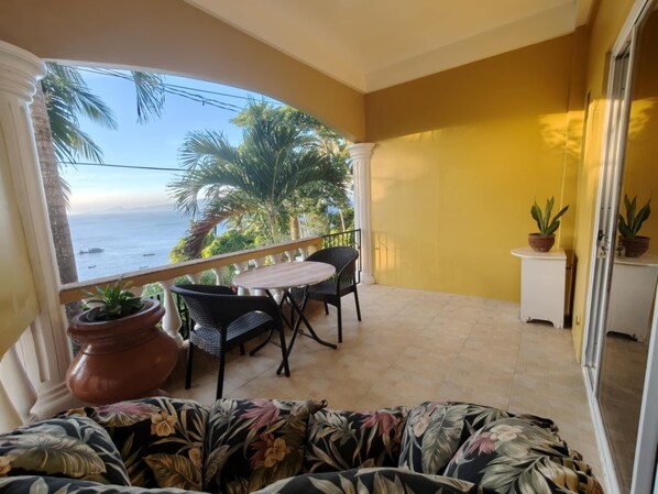 outdoor veranda seating and dining area 
