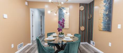 Stylish dining area with an inviting ambience. Enjoy plush velvet while dining.