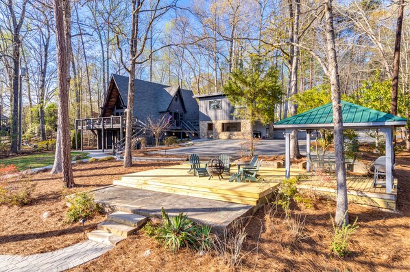 Patio w/ gazebo, grill, dining table & 4 Adirondacks