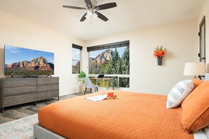 Wake-up to majestic views of Thunder Mountain in the primary bedroom