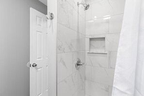 A spacious bathroom with everything you need to feel refreshed and rejuvenated.