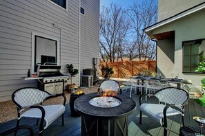 large back patio with grill and gas firepit