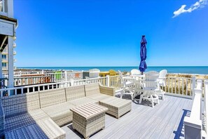 Deck with Couch and Table Seating.