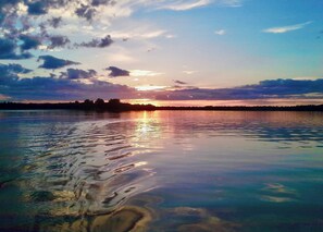 Gorgeous sunsets right from the living room, screen porch, deck, patio, or dock!